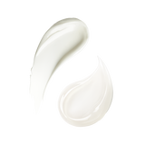 A smooth, glossy swipe of thick, creamy white cosmetic product, likely a cream or serum, on a solid white background.