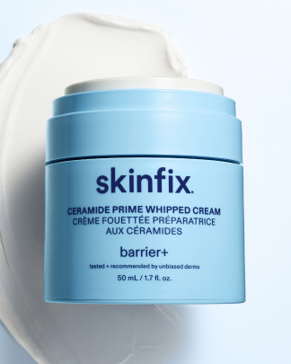 Skinfix Ceramide Prime Whipped Cream jar, 50 mL, in light blue packaging, resting against a cream texture swatch.