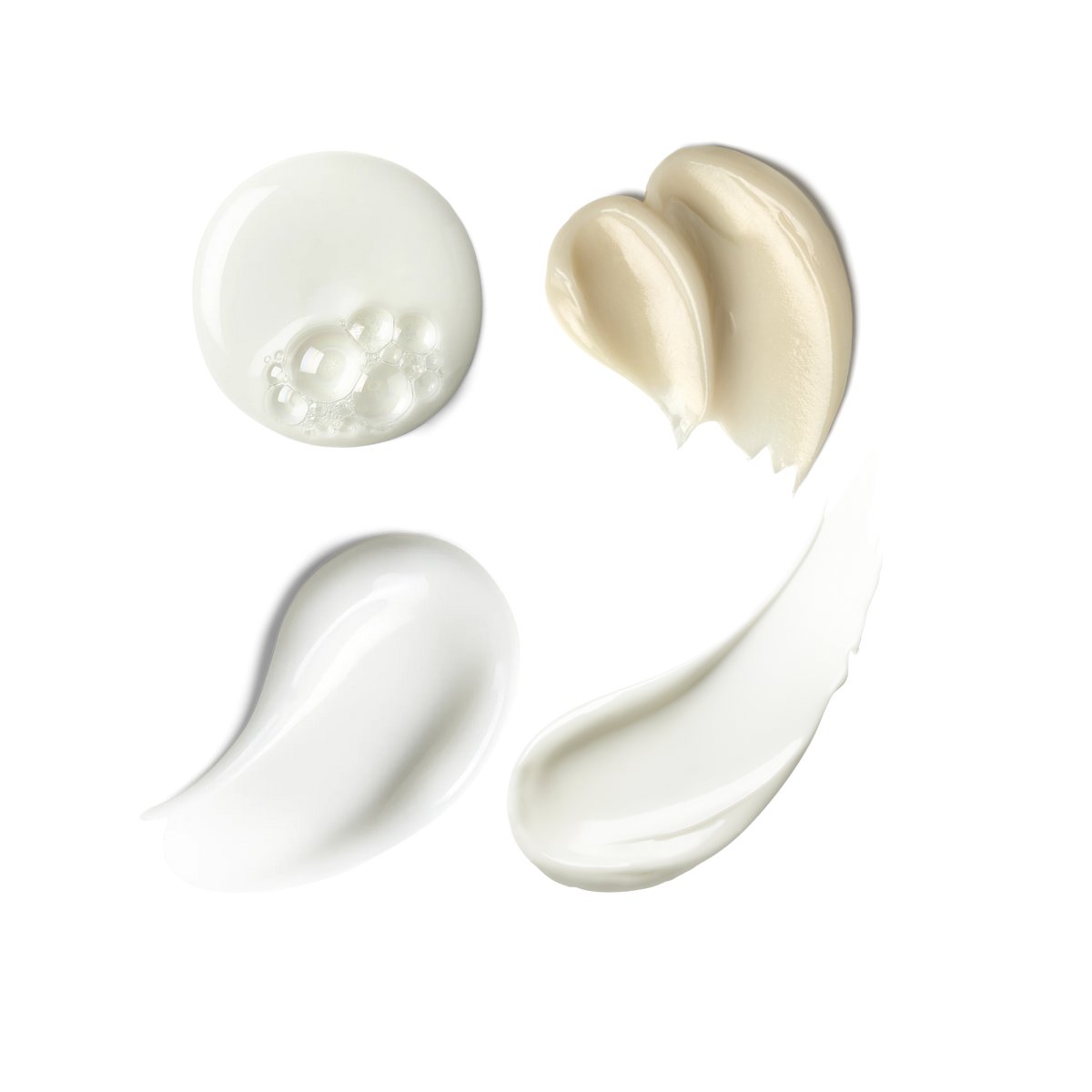 Four swatches of skincare: Hydrating Foaming Oil Cleanser, Exo + Ectoin Intensive Repair Baume, Triple Lipid Eye Treatment and Triple Lipid-Peptide Cream  showing product's texture on transparent background.