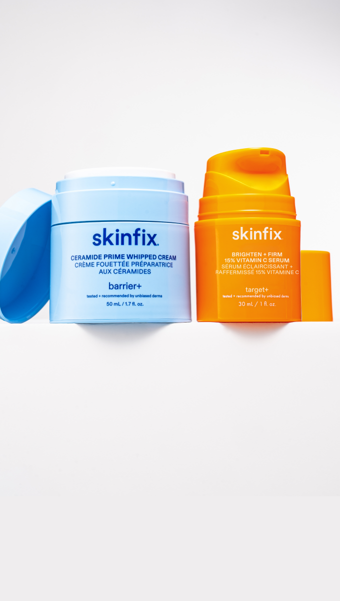 Skinfix Ceramide Prime Whipped Cream in light blue packaging with the lid open, and Brighten + Firm 15% Vitamin C Serum in orange packaging, on a white shelf.