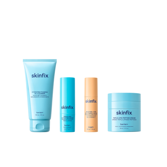 Four Skinfix products: Hydrating Foaming Oil Cleanser, Triple Lipid Activating Serum, Brighten + Firm 15% Vitamin C Serum, and Triple Lipid-Peptide Cream.