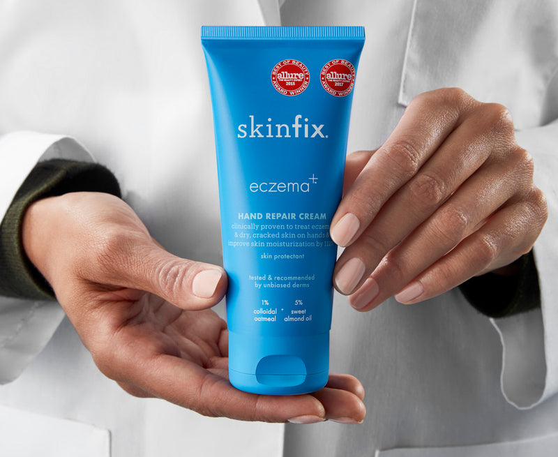 Dermatologist holding Skinfix Eczema+ hand repair cream