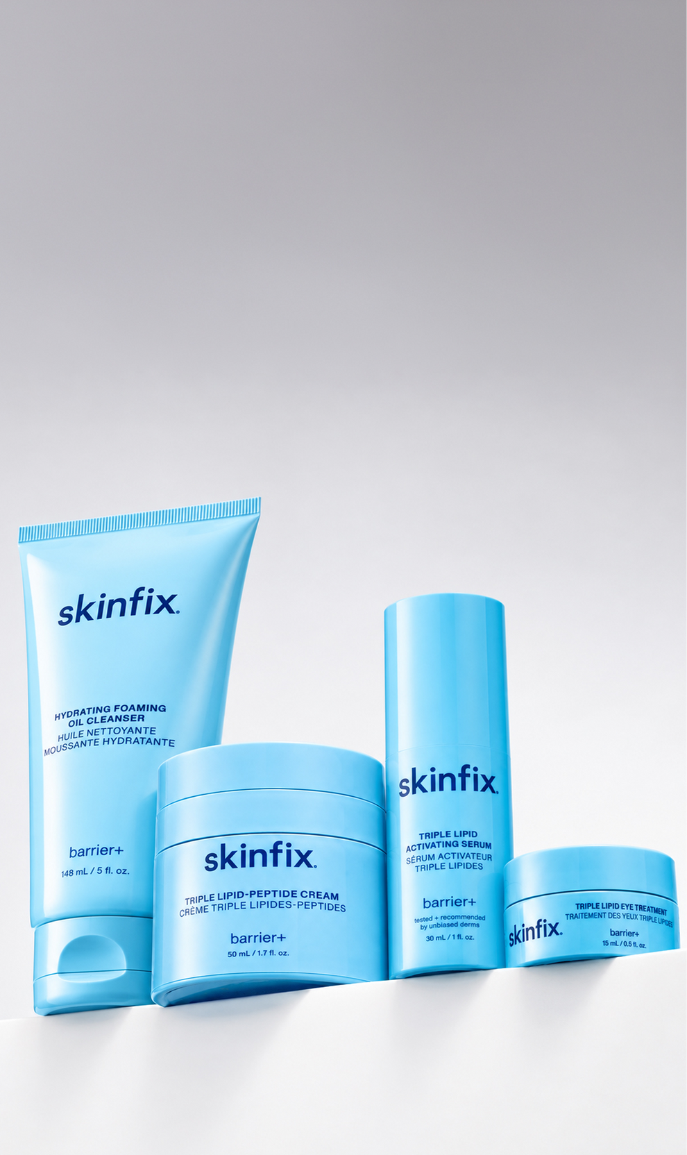 Skinfix Fall Ritual Kit – Hydrating Foaming Oil Cleanse, Triple Lipid-Peptide Cream, Triple Lipid Activating Serum and Triple Lipid Eye Treatment., set on white grey background.