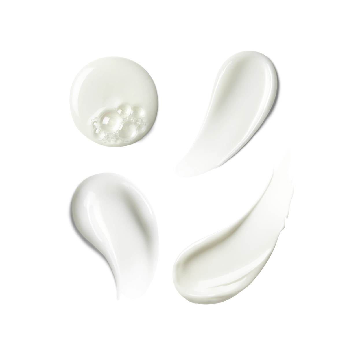 Four skincare textures on a transparent background – cleanser, serum, eye cream and moisturizer.
