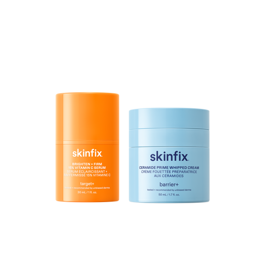 Skinfix Brighten + Firm 15% Vitamin C Serum (30 mL) in orange and Ceramide Prime Whipped Cream (50 mL) in light blue, on a transparent background.