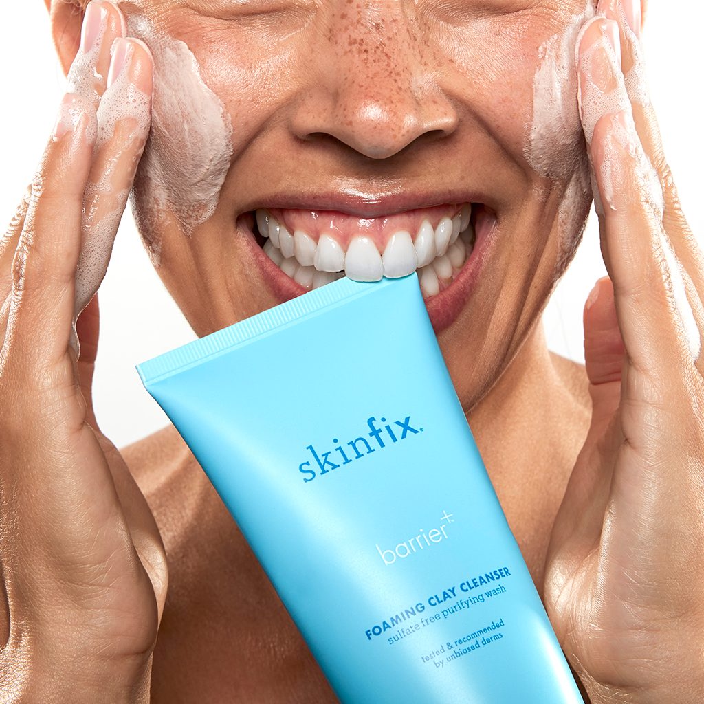 Skinfix customer washing face with foaming cleanser